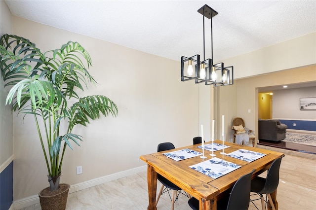 916 Shangri La Dr, Seffner, FL 33584 - dining space featuring a chandelier and baseboards