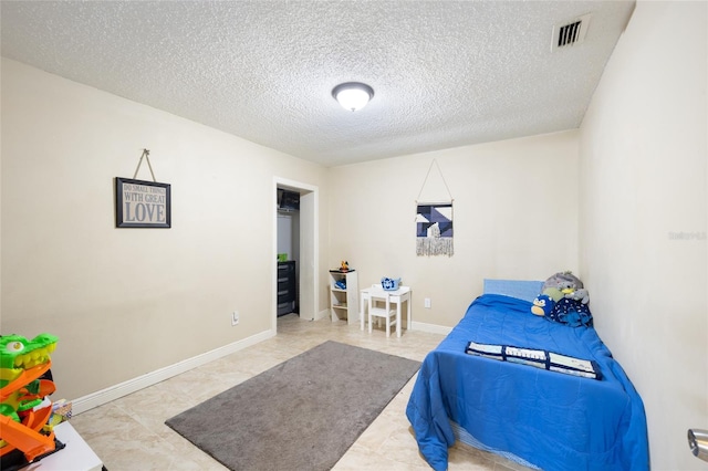 916 Shangri La Dr, Seffner, FL 33584 - bedroom with a textured ceiling and baseboards