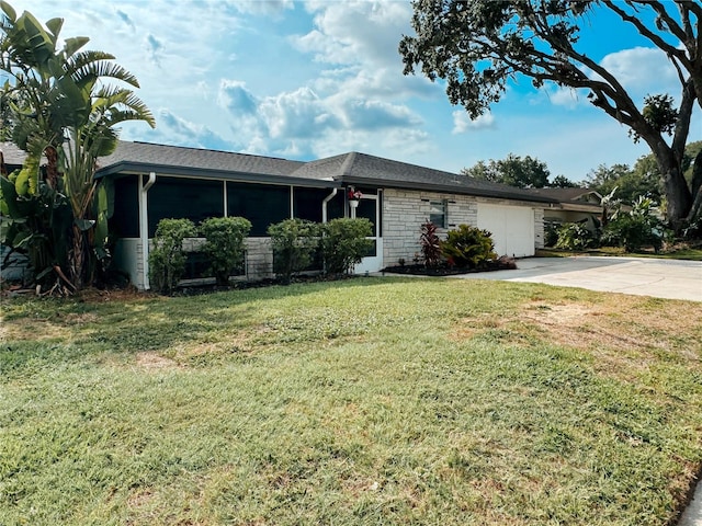 916 Shangri La Dr, Seffner, FL 33584 - ranch-style home with an attached garage, concrete driveway, a front lawn, and stone siding