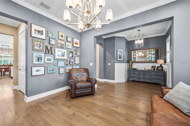 3611 W Royal Palm Cir, Tampa, FL 33629 - sitting room with a chandelier, hardwood / wood-style floors, baseboards, and ornamental molding