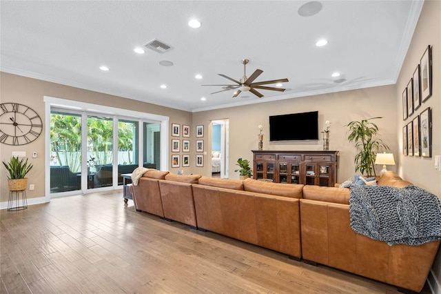 3611 W Royal Palm Cir, Tampa, FL 33629 - living room with ceiling fan, recessed lighting, light wood-style floors, ornamental molding, and baseboards