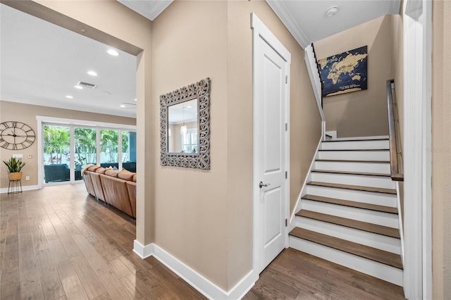 3611 W Royal Palm Cir, Tampa, FL 33629 - staircase with wood finished floors, baseboards, ornamental molding, and recessed lighting