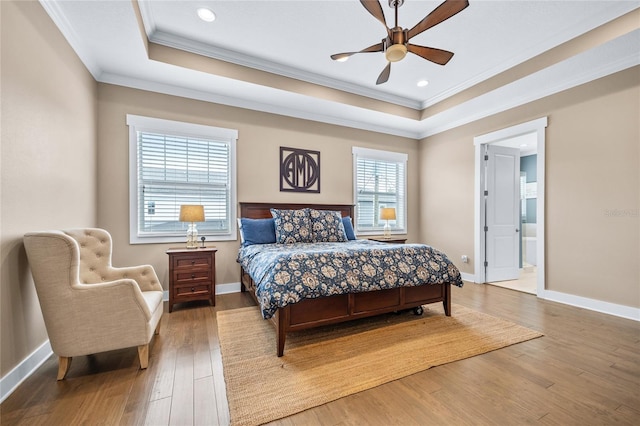 3611 W Royal Palm Cir, Tampa, FL 33629 - bedroom with ornamental molding, a tray ceiling, wood finished floors, baseboards, and recessed lighting