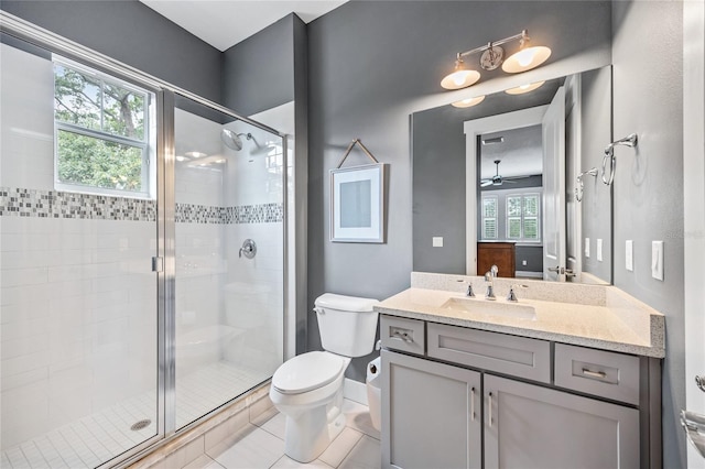 3611 W Royal Palm Cir, Tampa, FL 33629 - bathroom with a shower stall, toilet, vanity, and a ceiling fan