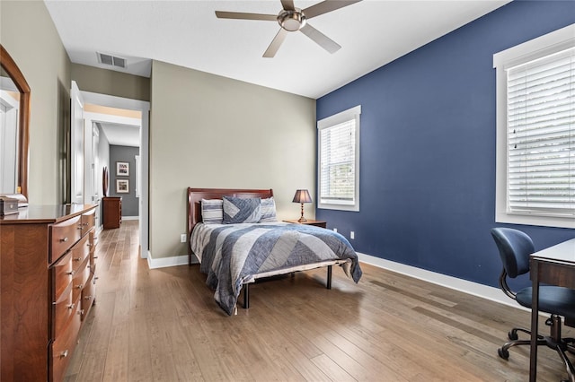 3611 W Royal Palm Cir, Tampa, FL 33629 - bedroom featuring hardwood / wood-style flooring, a desk, baseboards, and a ceiling fan