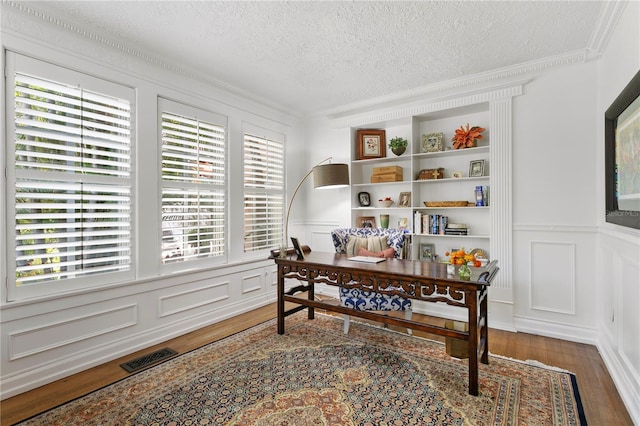 136 W Davis Blvd, Tampa, FL 33606 - office featuring a decorative wall, wood finished floors, a textured ceiling, crown molding, and wainscoting