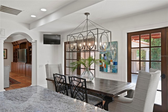 136 W Davis Blvd, Tampa, FL 33606 - dining room with a chandelier, arched walkways, decorative columns, tile patterned flooring, and recessed lighting