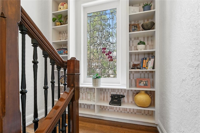 136 W Davis Blvd, Tampa, FL 33606 - stairway with a textured wall, wood finished floors, built in shelves, and baseboards