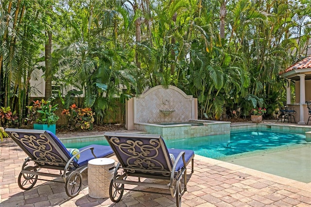 136 W Davis Blvd, Tampa, FL 33606 - view of swimming pool with a patio area and a pool with connected hot tub