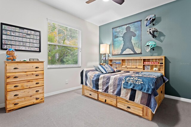 bedroom featuring carpet, baseboards, and ceiling fan