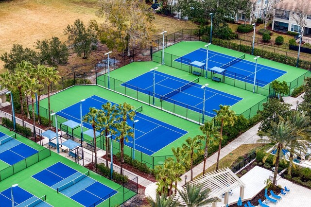 view of tennis court featuring fence