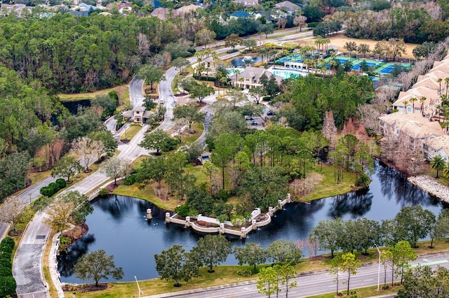 aerial view of property and surrounding area featuring a large body of water
