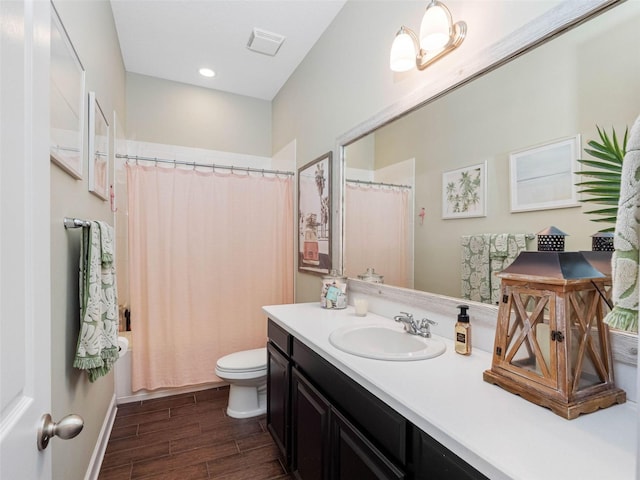 1104 Isobel Reserve Ln, Tampa, FL 33613 - bathroom with wood finished floors, toilet, vanity, and a shower with curtain