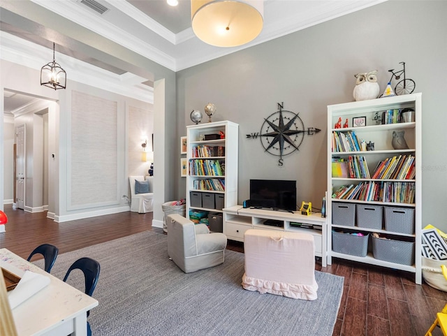 1104 Isobel Reserve Ln, Tampa, FL 33613 - living room with dark wood-type flooring, crown molding, and baseboards