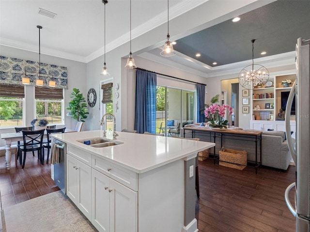 1104 Isobel Reserve Ln, Tampa, FL 33613 - kitchen with a sink, open floor plan, dishwasher, dark wood-type flooring, and crown molding