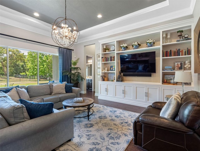 1104 Isobel Reserve Ln, Tampa, FL 33613 - living room with ornamental molding, a chandelier, wood finished floors, a raised ceiling, and baseboards