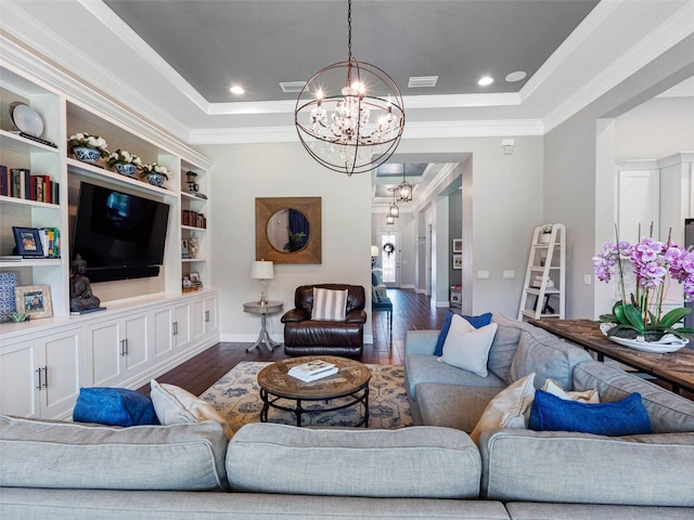 1104 Isobel Reserve Ln, Tampa, FL 33613 - living room with a chandelier, a tray ceiling, ornamental molding, dark wood-type flooring, and baseboards