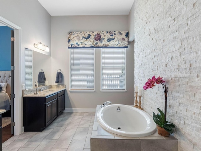 1104 Isobel Reserve Ln, Tampa, FL 33613 - bathroom with a bath, vanity, tile patterned flooring, and baseboards