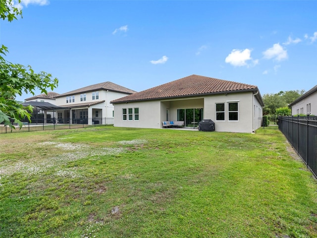 1104 Isobel Reserve Ln, Tampa, FL 33613 - rear view of house with stucco siding and a tiled roof