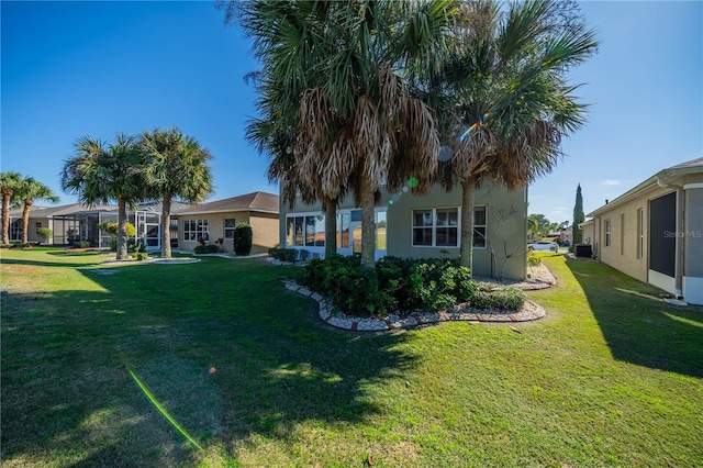 445 Noble Faire Dr, Sun City Center, FL 33573 - view of grassy yard featuring central AC