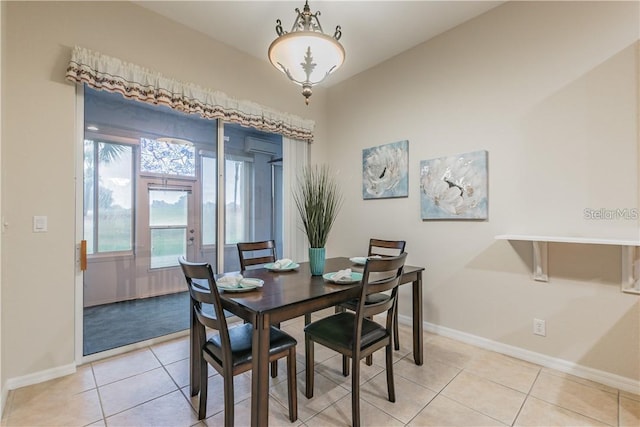 445 Noble Faire Dr, Sun City Center, FL 33573 - dining room featuring baseboards, light tile patterned floors, and an AC wall unit