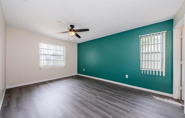 7763 Jenner Ave, New Port Richey, FL 34655 - empty room featuring healthy amount of natural light, a ceiling fan, and wood finished floors