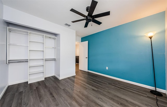 7763 Jenner Ave, New Port Richey, FL 34655 - unfurnished bedroom featuring wood finished floors, baseboards, a closet, and a ceiling fan