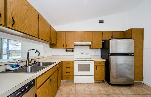 7763 Jenner Ave, New Port Richey, FL 34655 - kitchen featuring appliances with stainless steel finishes, under cabinet range hood, vaulted ceiling, a sink, and brown cabinetry