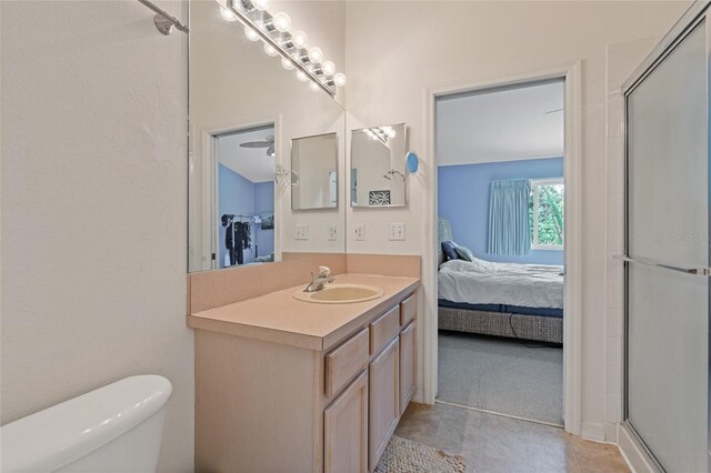 11162 Kapok Grand Cir, Madeira Beach, FL 33708 - ensuite bathroom featuring vanity and an enclosed shower