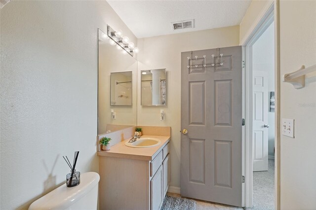 11162 Kapok Grand Cir, Madeira Beach, FL 33708 - full bathroom with toilet and vanity