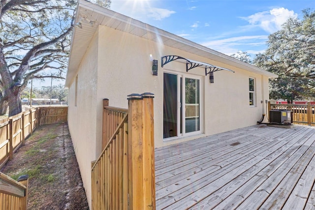 deck featuring central AC and a fenced backyard