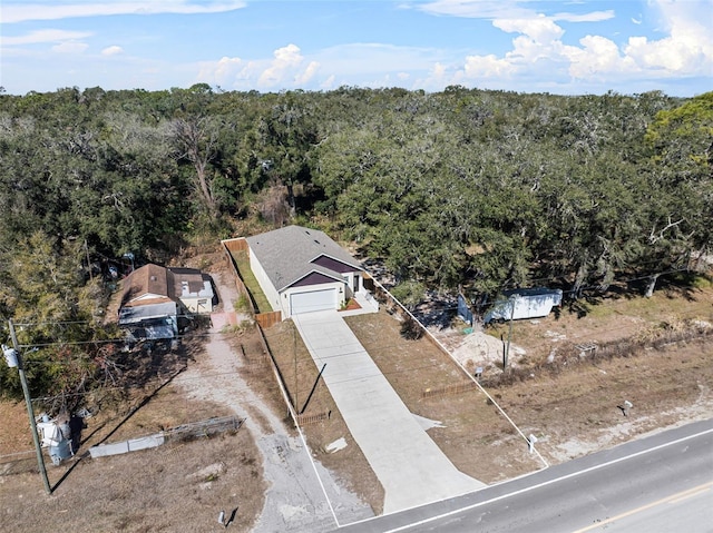drone / aerial view with a view of trees