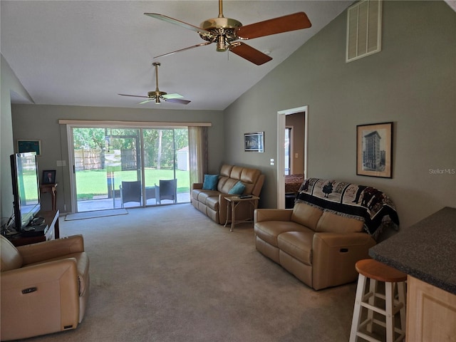 827 Creekside Ln, Palm Harbor, FL 34684 - carpeted living area with a ceiling fan and high vaulted ceiling