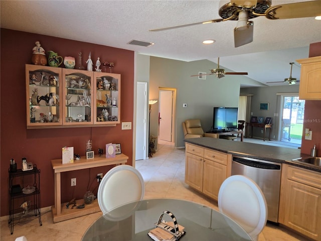827 Creekside Ln, Palm Harbor, FL 34684 - kitchen with dishwasher, light brown cabinets, dark countertops, a ceiling fan, and a textured ceiling