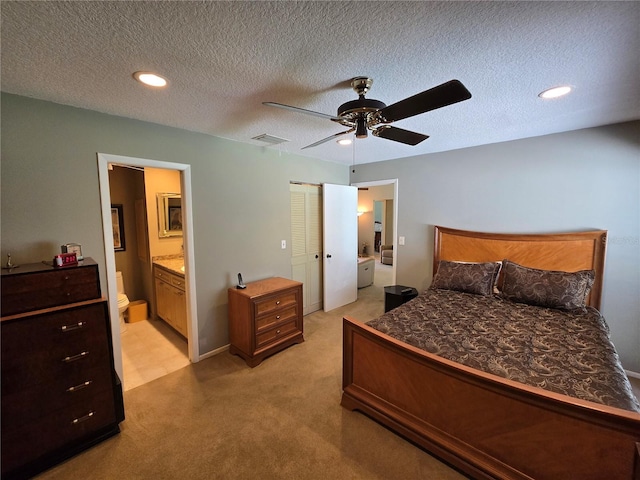 827 Creekside Ln, Palm Harbor, FL 34684 - bedroom with light colored carpet, ensuite bath, recessed lighting, a textured ceiling, and ceiling fan