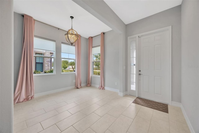 entrance foyer featuring light tile patterned floors and baseboards
