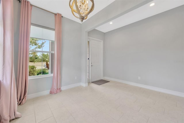 unfurnished room featuring a chandelier, baseboards, and recessed lighting