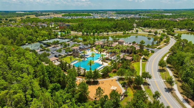 drone / aerial view of a large body of water and a pool