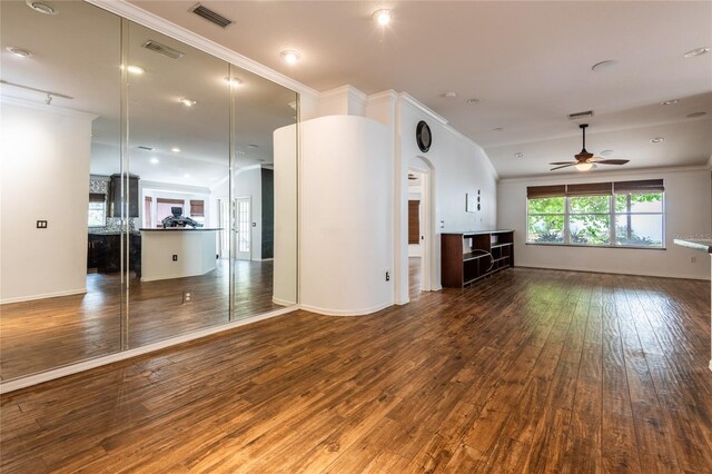2008 Berry Lake Dr, Brandon, FL 33510 - unfurnished living room featuring baseboards, ornamental molding, ceiling fan, wood-type flooring, and visible vents