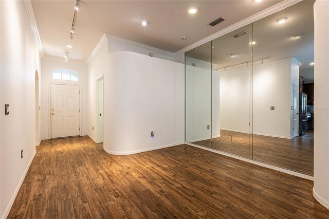 2008 Berry Lake Dr, Brandon, FL 33510 - entrance foyer featuring rail lighting, ornamental molding, baseboards, and wood finished floors