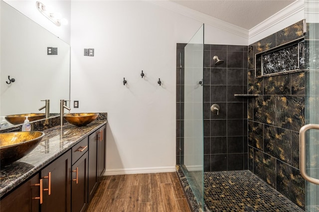 2008 Berry Lake Dr, Brandon, FL 33510 - full bath with a sink, wood finished floors, ornamental molding, a shower stall, and double vanity