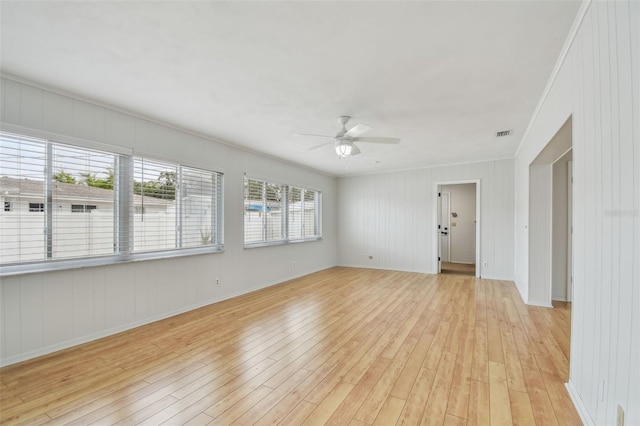 11762 82nd Ter, Seminole, FL 33772 - unfurnished room featuring light wood-type flooring, ceiling fan, crown molding, and baseboards