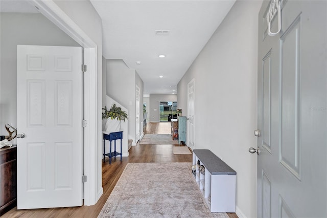 12710 Hysmith Loop, Parrish, FL 34219 - entryway featuring wood finished floors, baseboards, and recessed lighting