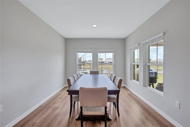 12710 Hysmith Loop, Parrish, FL 34219 - dining room with light wood-style floors, baseboards, and a water view