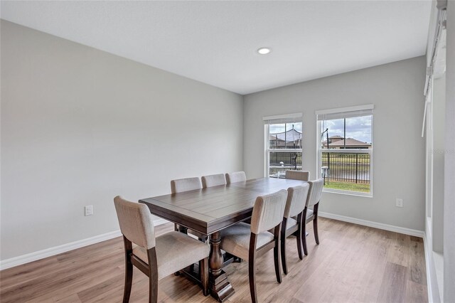 12710 Hysmith Loop, Parrish, FL 34219 - dining space featuring baseboards, light wood-style flooring, and recessed lighting