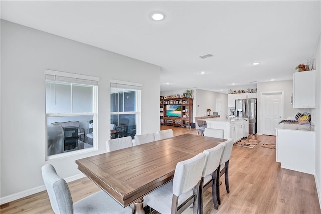 12710 Hysmith Loop, Parrish, FL 34219 - dining room with light wood-type flooring, recessed lighting, and baseboards