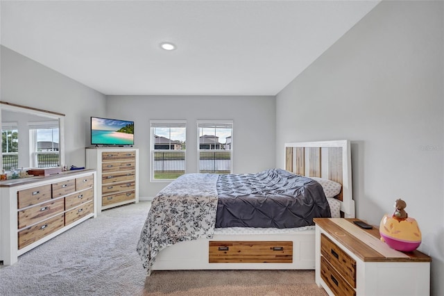 12710 Hysmith Loop, Parrish, FL 34219 - bedroom featuring light colored carpet and multiple windows