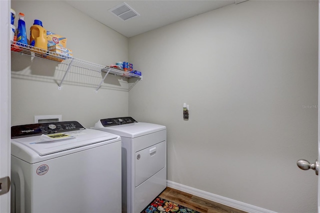 12710 Hysmith Loop, Parrish, FL 34219 - washroom featuring washer and dryer, wood finished floors, and baseboards