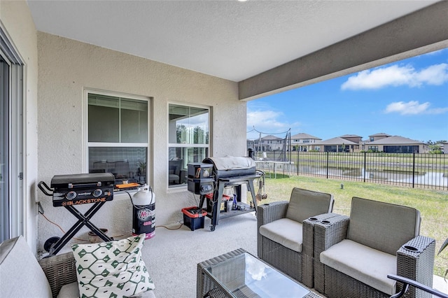12710 Hysmith Loop, Parrish, FL 34219 - view of patio featuring a water view, fence, a residential view, and area for grilling