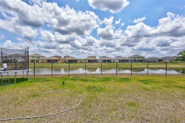 12710 Hysmith Loop, Parrish, FL 34219 - view of yard with a trampoline, a residential view, and a water view
